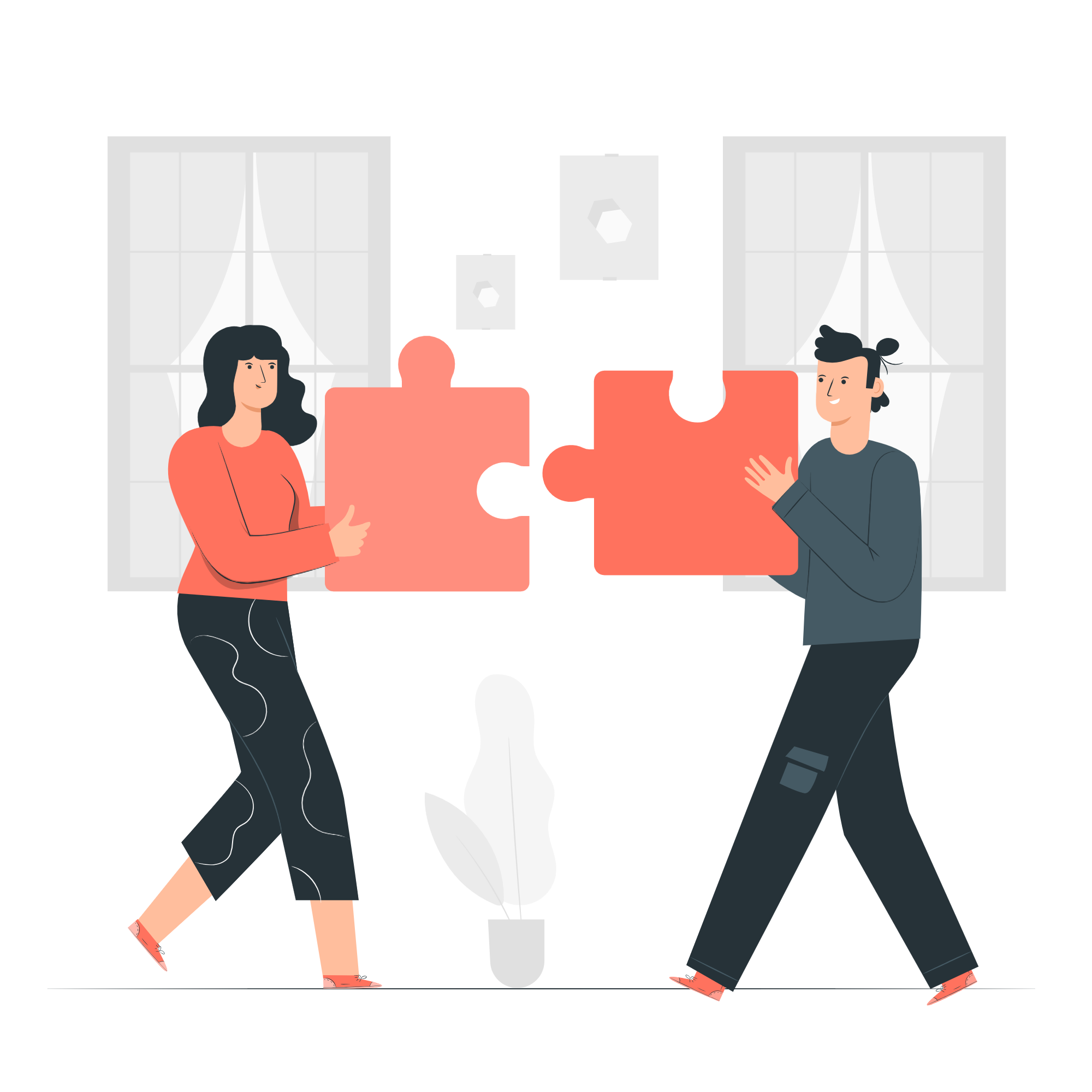 Two people joining two large puzzle pieces together